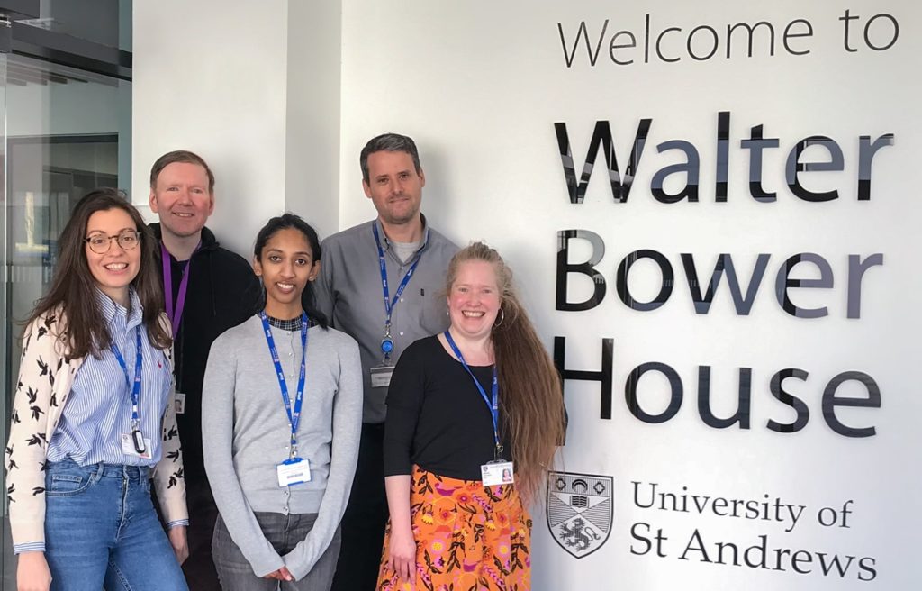 Open Access Team in front of Walter Bower House sign